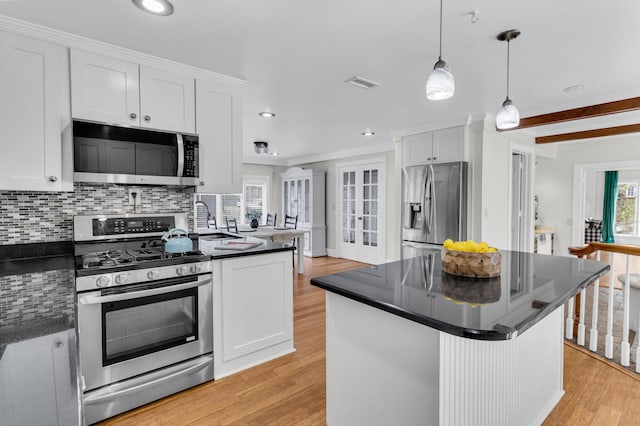 428 Carn St, Walterboro, SC 29488 - kitchen with visible vents, stainless steel appliances, dark countertops, and white cabinets