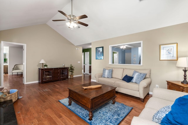 living room with ceiling fan, lofted ceiling, and dark hardwood / wood-style floors