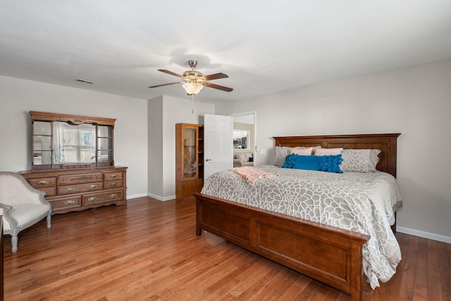 bedroom featuring hardwood / wood-style flooring and ceiling fan