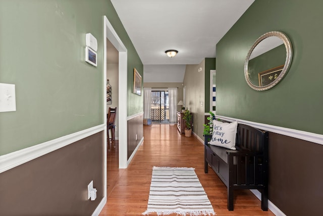 hallway with hardwood / wood-style floors