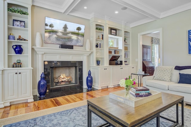 750 Navigators Run, Mount Pleasant, SC 29464 - living room with wood finished floors, crown molding, a tiled fireplace, beamed ceiling, and built in features
