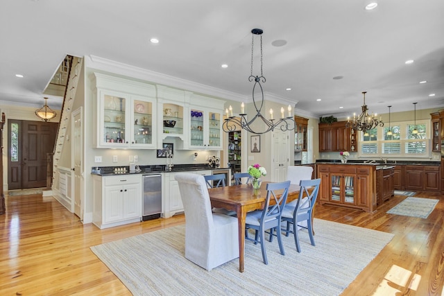 750 Navigators Run, Mount Pleasant, SC 29464 - dining area featuring ornamental molding, a chandelier, light wood-style flooring, recessed lighting, and bar area