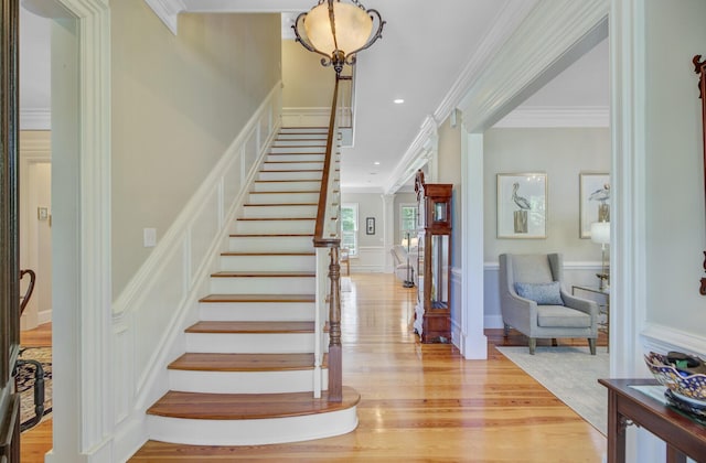 750 Navigators Run, Mount Pleasant, SC 29464 - stairway with crown molding, wood finished floors, a decorative wall, recessed lighting, and wainscoting