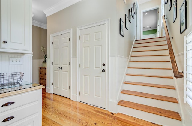 750 Navigators Run, Mount Pleasant, SC 29464 - entrance foyer featuring ornamental molding, stairway, wainscoting, and light wood finished floors