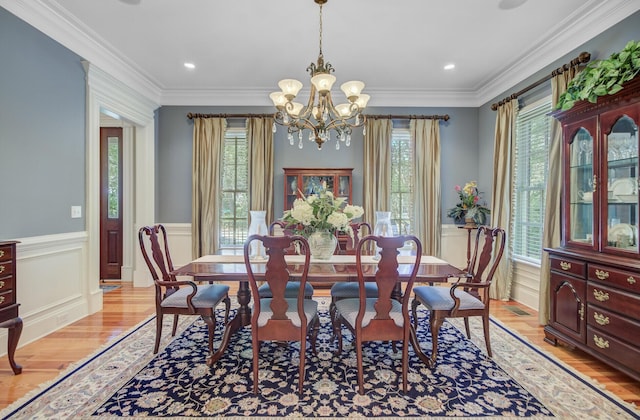 750 Navigators Run, Mount Pleasant, SC 29464 - dining room with light wood finished floors, healthy amount of natural light, wainscoting, a chandelier, and crown molding
