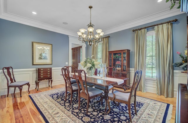 750 Navigators Run, Mount Pleasant, SC 29464 - dining area with a chandelier, healthy amount of natural light, light wood finished floors, wainscoting, and ornamental molding