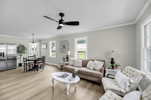 209 Pineview Dr, Goose Creek, SC 29445 - living room featuring light wood-type flooring, ceiling fan, crown molding, and baseboards
