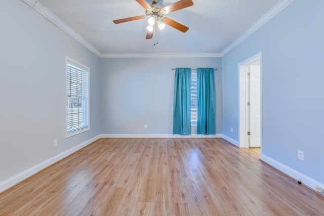 unfurnished room with light wood-type flooring, baseboards, ornamental molding, and a ceiling fan