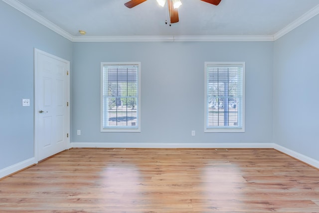 empty room featuring ceiling fan, light wood-type flooring, baseboards, and ornamental molding