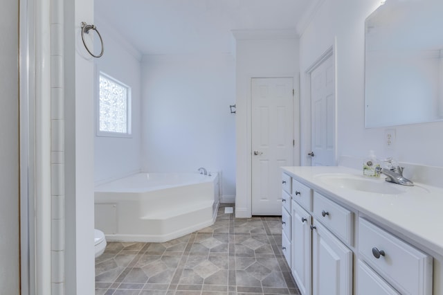 bathroom featuring a bath, toilet, vanity, and ornamental molding