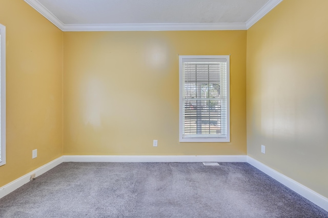 unfurnished room featuring visible vents, carpet floors, baseboards, and ornamental molding