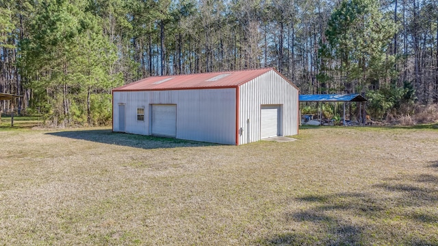 view of outbuilding featuring an outbuilding and a view of trees