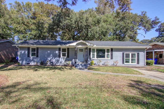 ranch-style home featuring a front yard