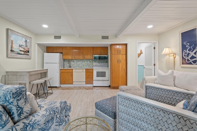 living room featuring light hardwood / wood-style floors and beam ceiling