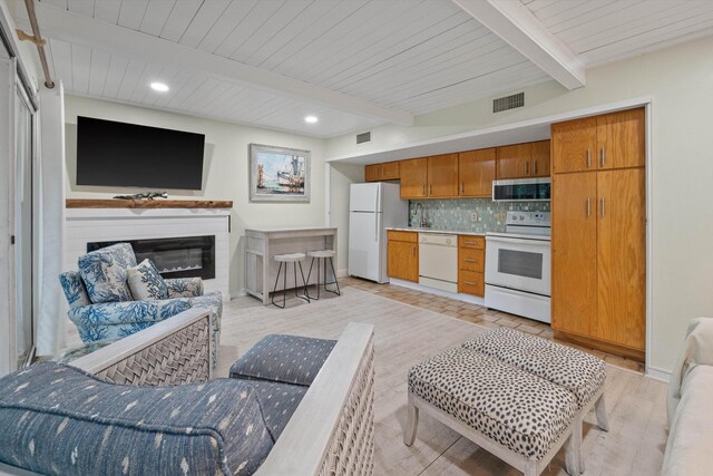 living room with wood ceiling, sink, beamed ceiling, and light hardwood / wood-style floors