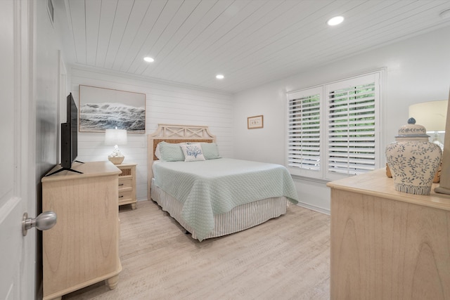 bedroom with wood ceiling and light hardwood / wood-style flooring