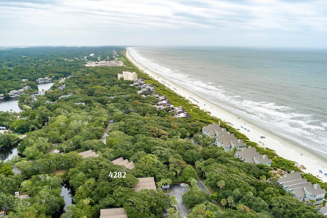 birds eye view of property featuring a water view and a view of the beach