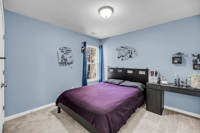 bedroom featuring visible vents, baseboards, and light colored carpet