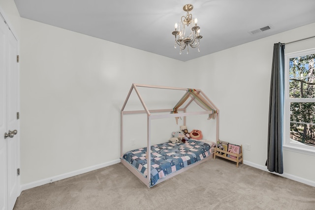 bedroom with a notable chandelier, visible vents, carpet flooring, and baseboards