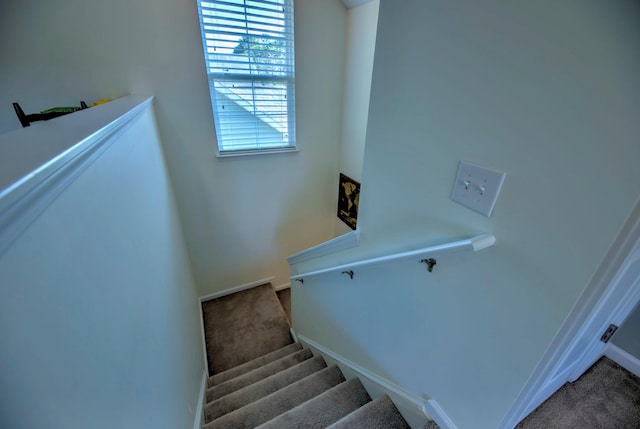 staircase with carpet flooring and baseboards