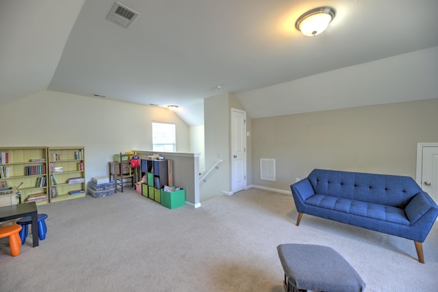 recreation room with visible vents, carpet, and vaulted ceiling