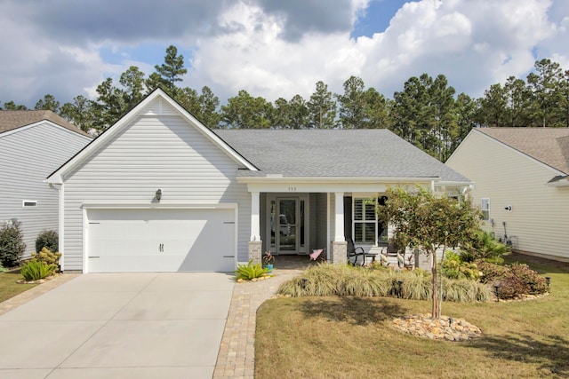 view of front of property with a front lawn and a garage