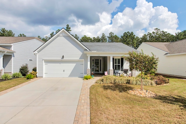 view of front of property featuring a garage and a front yard