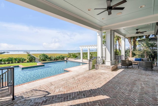 view of pool featuring a patio, an outdoor hangout area, a pergola, ceiling fan, and a water view