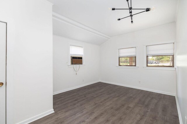 5065 Durant Ave, North Charleston, SC 29405 - empty room featuring dark wood-style flooring, a chandelier, cooling unit, and vaulted ceiling