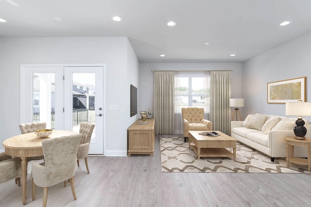 living area featuring recessed lighting, light wood-type flooring, and baseboards