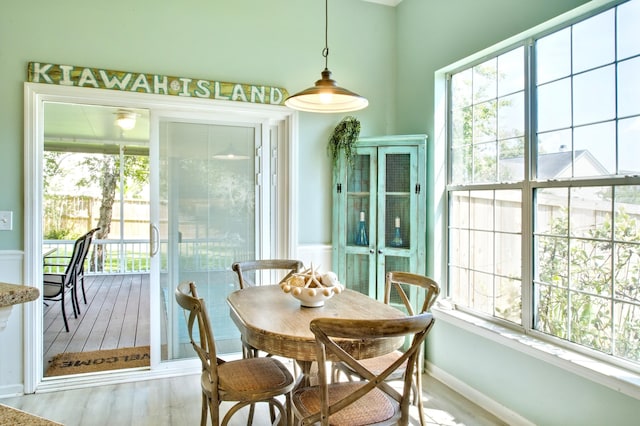 6159 Fieldstone Cir, Charleston, SC 29414 - dining space featuring healthy amount of natural light, light wood-style floors, and a wainscoted wall