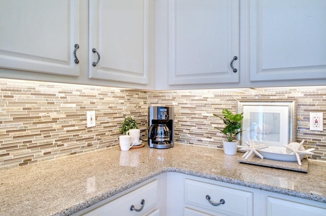 6159 Fieldstone Cir, Charleston, SC 29414 - kitchen with white cabinets, tasteful backsplash, and light stone counters