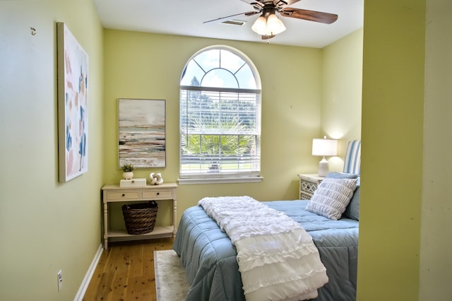 6159 Fieldstone Cir, Charleston, SC 29414 - bedroom with wood finished floors, multiple windows, and a ceiling fan
