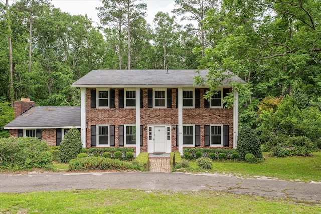 1019 Pinon Rd, North Augusta, SC 29841 - view of front facade featuring brick siding and a chimney