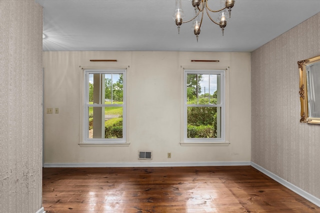 1019 Pinon Rd, North Augusta, SC 29841 - unfurnished room with wood-type flooring and a chandelier