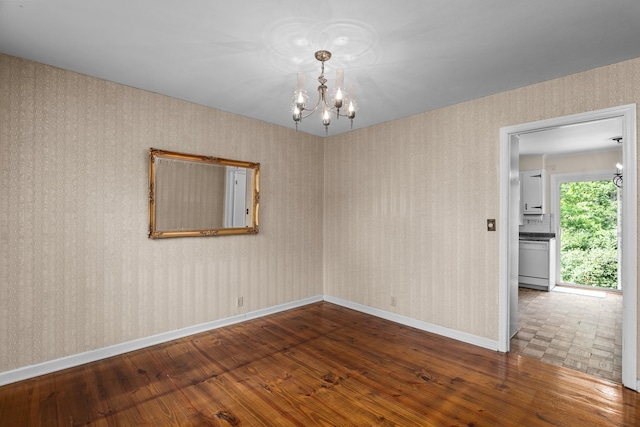 1019 Pinon Rd, North Augusta, SC 29841 - empty room featuring wood-type flooring, a chandelier, and wallpapered walls