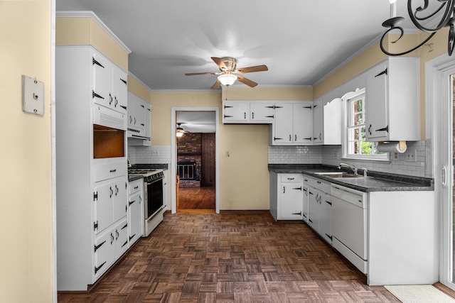 1019 Pinon Rd, North Augusta, SC 29841 - kitchen featuring white appliances, dark countertops, a ceiling fan, decorative backsplash, and white cabinetry