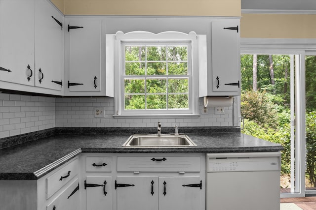 1019 Pinon Rd, North Augusta, SC 29841 - kitchen featuring white dishwasher, dark countertops, white cabinets, and ornamental molding