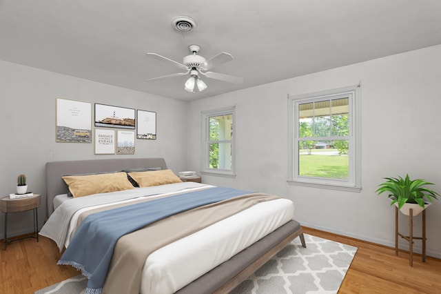 1019 Pinon Rd, North Augusta, SC 29841 - bedroom featuring multiple windows, wood finished floors, and ceiling fan