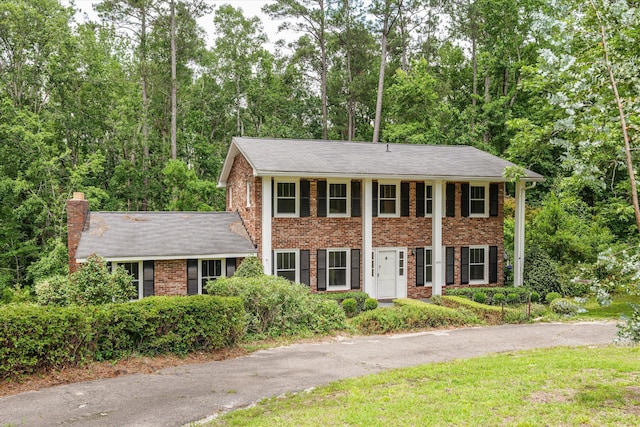 1019 Pinon Rd, North Augusta, SC 29841 - neoclassical / greek revival house featuring brick siding, a chimney, and roof with shingles