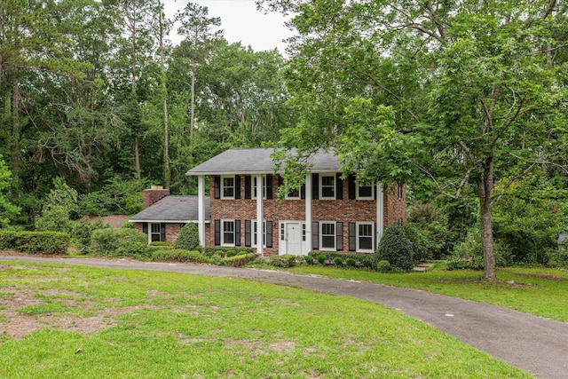 1019 Pinon Rd, North Augusta, SC 29841 - greek revival house featuring a front lawn and brick siding