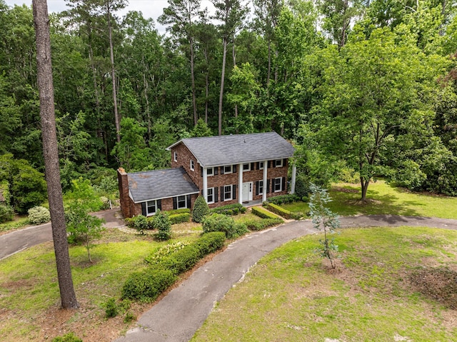 1019 Pinon Rd, North Augusta, SC 29841 - greek revival inspired property featuring asphalt driveway, brick siding, a chimney, and a front lawn