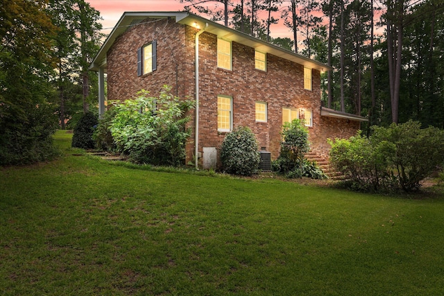 1019 Pinon Rd, North Augusta, SC 29841 - property exterior at dusk featuring a yard and brick siding