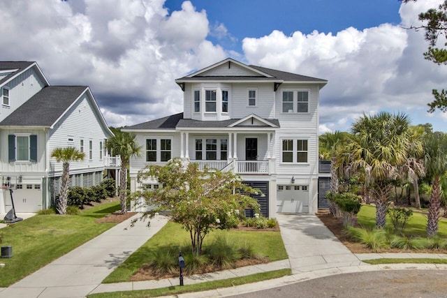 beach home with a front yard and a garage