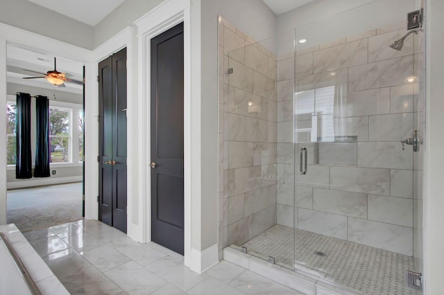 bathroom featuring ceiling fan and walk in shower