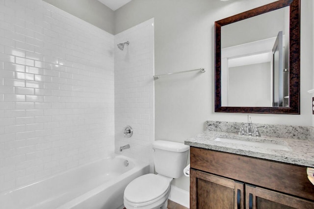 full bathroom with vanity, toilet, and tiled shower / bath