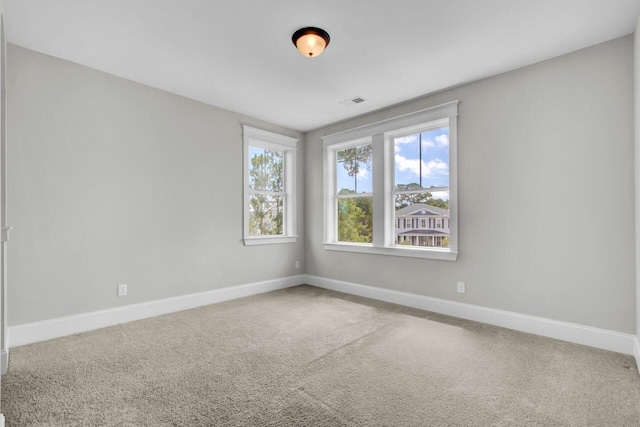 unfurnished room with carpet flooring