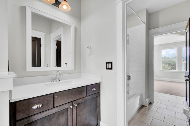 bathroom with vanity, tile patterned floors, and shower / washtub combination