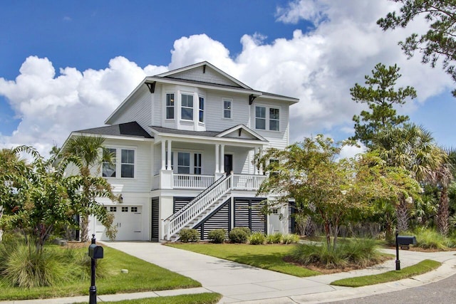 raised beach house featuring covered porch, a garage, and a front yard