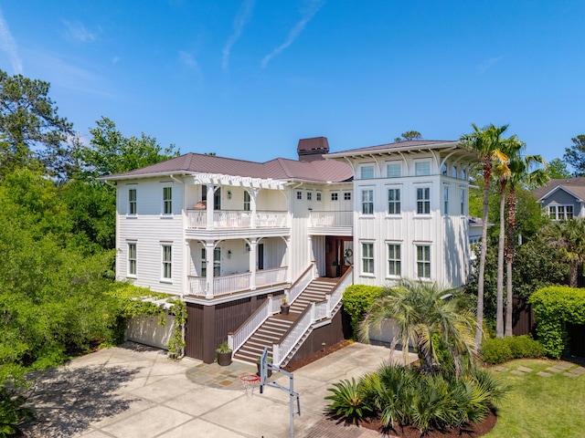 337 Evian Way, Mount Pleasant, SC 29464 - exterior space with stairs, a balcony, driveway, and metal roof
